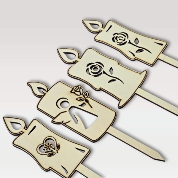 Lesene sveče na piku iz vezane plošče z različnimi motivi